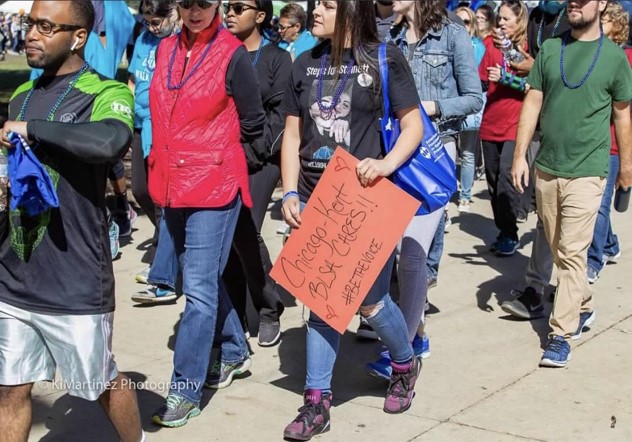 2018 IL Out of the Darkness Walk (students walking with signs)